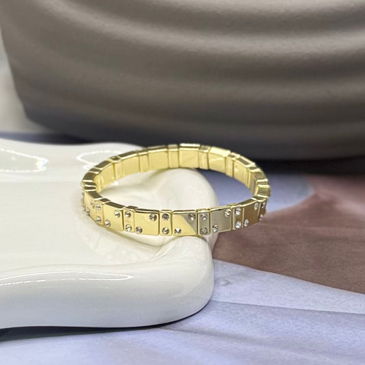 PULSERA DORADA CON PIEDRA BLANCA