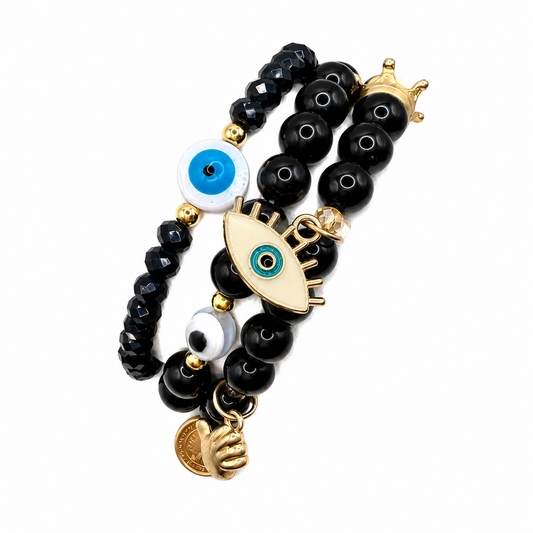 Set de pulseras piedras negras con dijes y ojitos
