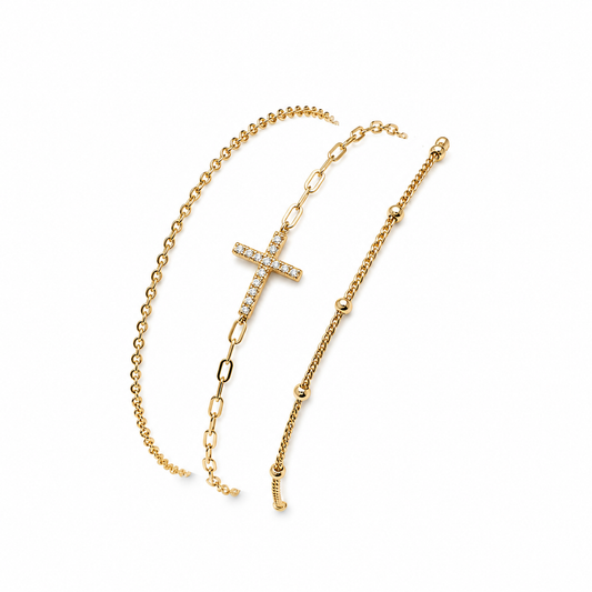 Pulsera dorada triple con cruz